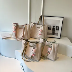 Large capacity quilted tote bags in four colors with cute pink monster charms for commute