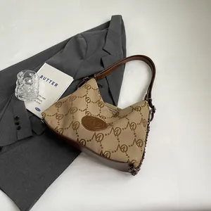 Large vintage canvas tote bag with chain strap and monogram leather trim