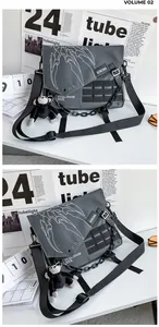Close-up of waterproof nylon techwear crossbody bag with tactical buckles and chains