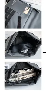 Detail view of large dark grey nylon messenger bag with internal zip pockets and layers