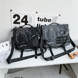 Japanese style nylon messenger bag with claw print and decorative chain detail