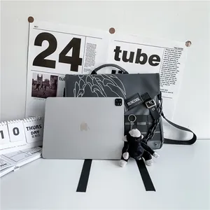 Waterproof nylon messenger bag in dark grey with abstract print and monkey charm