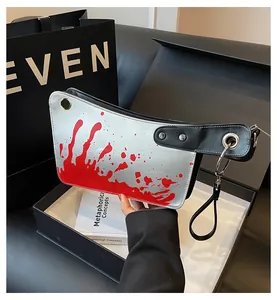 Creative silver cleaver-shaped clutch bag featuring realistic red blood splatter design