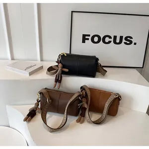 Three Boston style crossbody bags in black, brown and caramel with woven straps