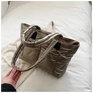 Top view of large metallic bronze quilted tote bag with padded down-like texture