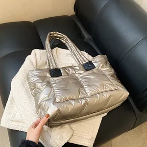 Champagne gold quilted puffer tote bag with metallic finish and large capacity style