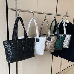 Quilted puffer tote bags in multiple metallic colors with double front pockets and handles
