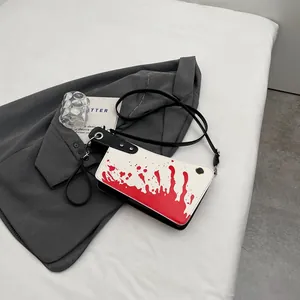 Creative cleaver shaped shoulder bag with blood splatter print and black strap