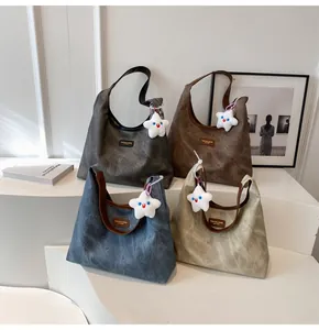 Macro detail of retro textured tote bags in four colors with star plush pendants