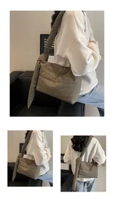 Quilted olive green puffer shoulder bag featuring oversized side knot strap details