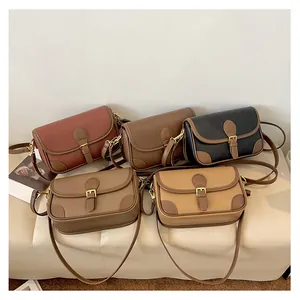 Detail showing vintage flap crossbody bags in five colors with litchi grain texture