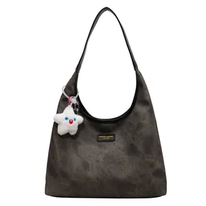 Retro grey hobo shoulder bag with a vintage texture and a cute plush star charm pendant