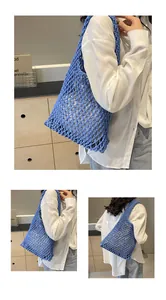 Detail of blue hand-woven cotton rope tote bag with intricate hollow mesh pattern