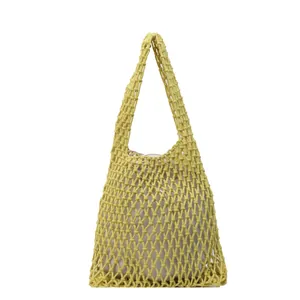 Handmade yellow woven cotton mesh tote bag with beige inner pouch for beach vacation