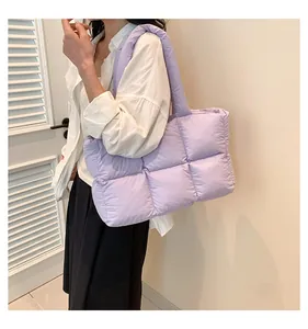 Detailed view of the light purple quilted down tote bag with a soft padded finish