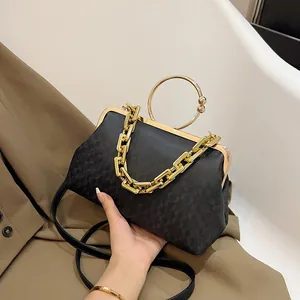 Chic black gradient chain crossbody bag with gold ring handle and quilted pattern detail