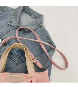 Pink canvas tote bag with adjustable shoulder strap and KFRBAG embroidered leather patch
