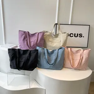 Minimalist nylon tote bags in five colors with large capacity and front pockets