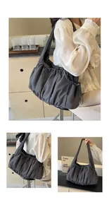 Detail of dark grey pleated cloud tote bag showing soft nylon texture and drawstring