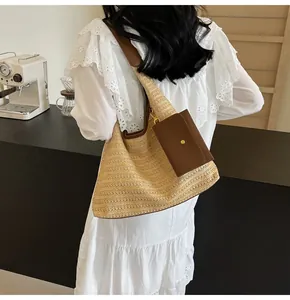 Close-up of woven straw tote bag texture and small brown leather pouch on a white lace dress