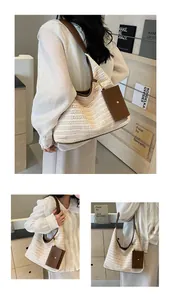 Detail of a woven straw tote with brown leather trim and a hanging side pouch