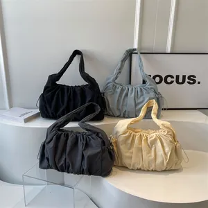 Minimalist ruched cloud bag with drawstring and wide strap in four neutral colors