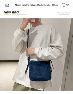 Mirror selfie showing the blue denim crossbody bucket bag on a 165cm female model