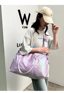 Detailed view of iridescent purple gym bag with shiny finish and adjustable strap