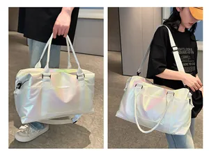 Luminous laser travel bag with waterproof glossy finish showing hand-carry and shoulder use