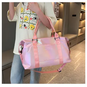 Detail view of pink holographic travel bag with glossy finish and durable woven handles