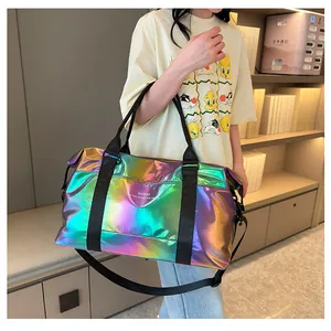 Detail of holographic gym bag with metallic finish showing shoulder strap and handles