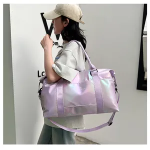 Detail of holographic purple waterproof travel bag with adjustable strap and metallic finish