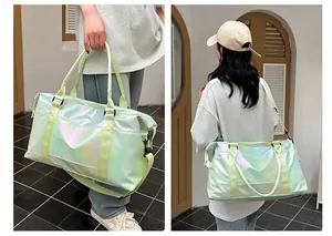 Detail of waterproof holographic travel bag with dual handles and adjustable strap