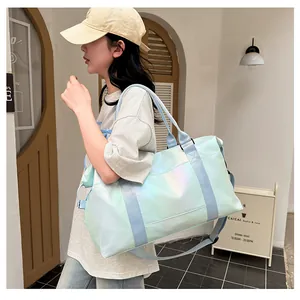 Lifestyle shot of light blue iridescent travel bag with adjustable strap and pearly finish