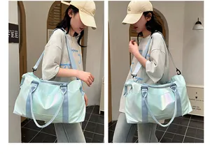 Detail of holographic waterproof travel bag showing the iridescent fabric and shoulder strap