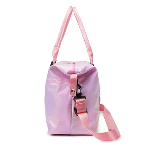 Pink iridescent waterproof travel duffel bag with handles and adjustable shoulder strap