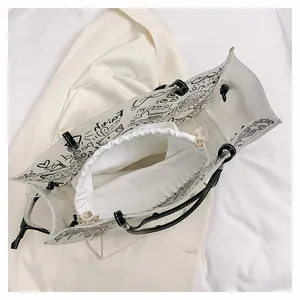 Detailed interior of a transparent graffiti tote bag with a white canvas drawstring liner