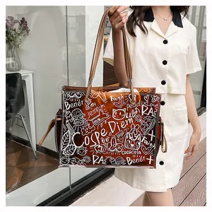 Close-up of brown semi-transparent jelly tote bag with white street style graffiti art