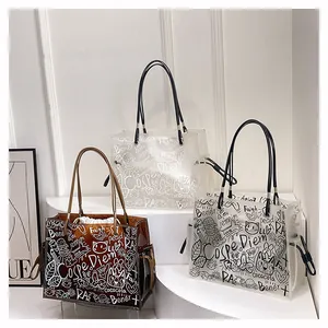 Detail view of large graffiti PVC jelly tote bags in clear, brown, and matte finishes