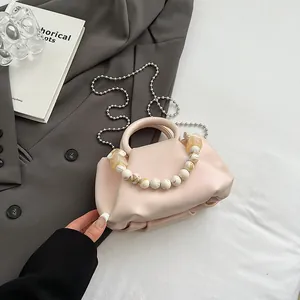 Beige pleated dumpling bag with marble beaded handle and silver chain strap for women