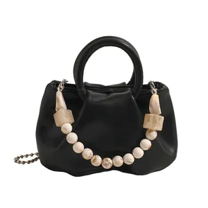 Chic black cloud-shaped pleated handbag with decorative marble-bead chain and ring handles