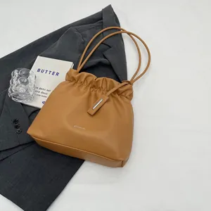 Brown faux leather crossbody bucket bag with drawstring pleated detail for women