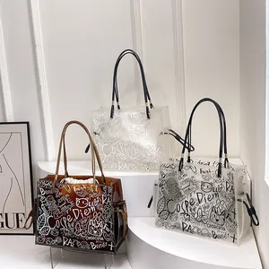 Transparent graffiti tote bag with inner pouch and dual shoulder straps for summer