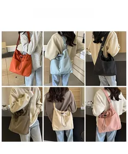 Detail display of drawstring bucket bags in six colors with adjustable straps