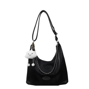 Black pebbled leather hobo bag with silver chain and white cloud charm decoration