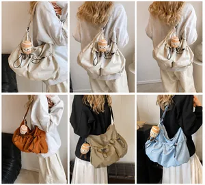Collage of different colors of drawstring bucket bags with cute plush charms on models