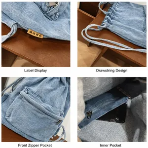 Détails du sac en jean à cordon montrant la poche zippée et la texture de l'étiquette