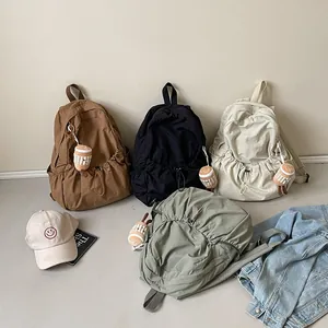 Chic ruched nylon backpack for women in multiple colors with cute plush pendant