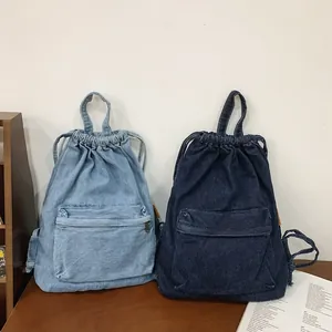 Sac à dos décontracté en denim avec cordon de serrage en bleu clair et foncé