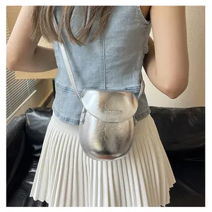 Silver metallic saddle bag with 'FASHION & BAGS PARIS' text shown on a model